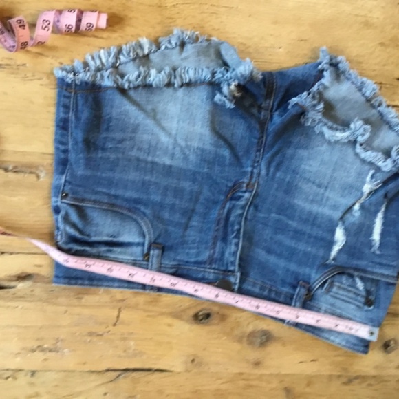 29” STS Blue jean shorts feature a distressed design with a dark blue wash - Picture 5 of 8